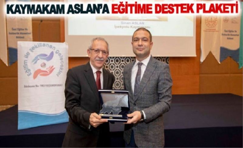 Kaymakam Aslan’a eğitime destek plaketi