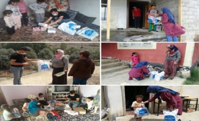 Gürpınar’da Bir Çocukta Sen Giydir projesi kapsamında toplanan kıyafetler dağıtılıyor